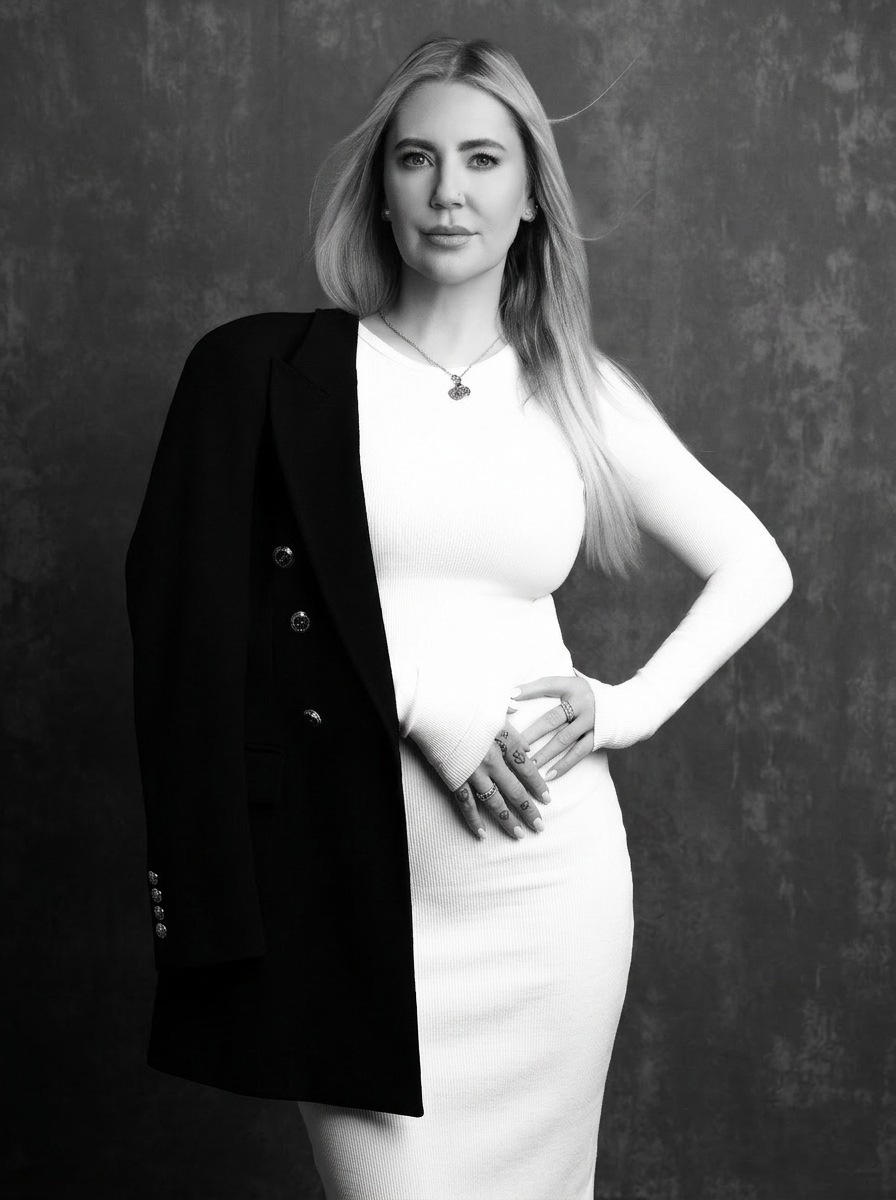 Black-and-white editorial portrait of Georgii Speakman, founder of OUT.LI.ER