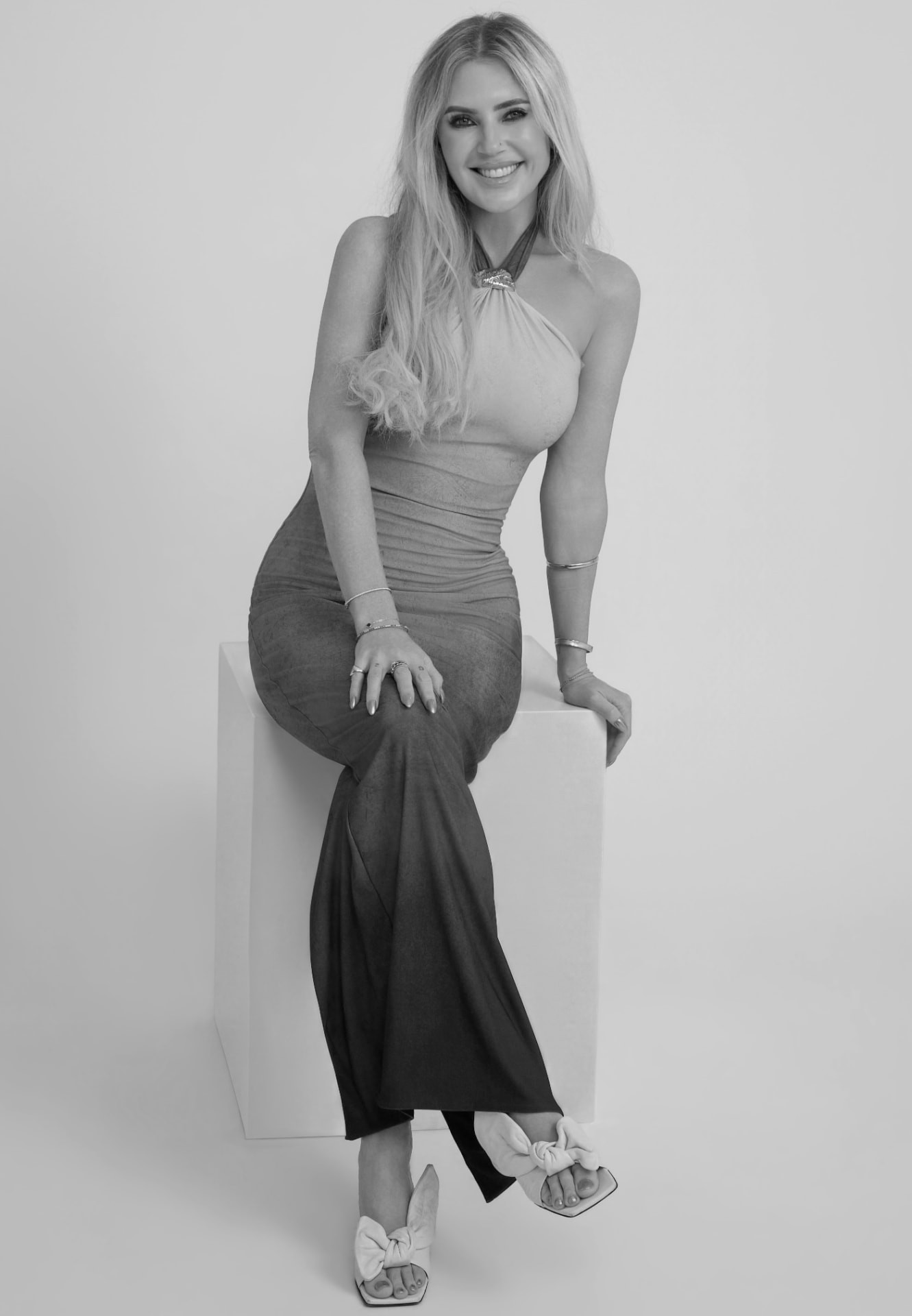 Black-and-white editorial portrait of Georgii Speakman, founder of OUT.LI.ER